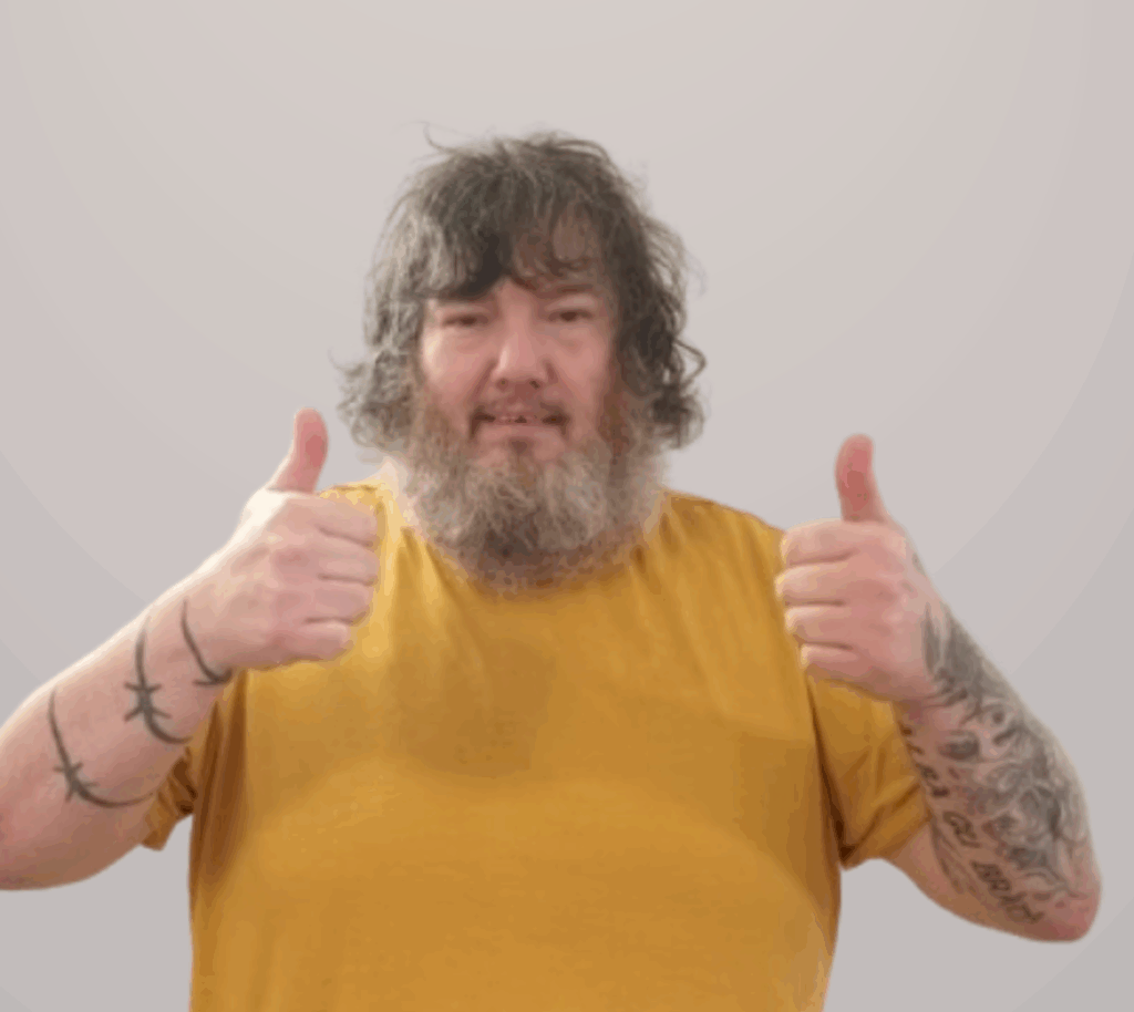 An image showing a man doing 2 thumbs up