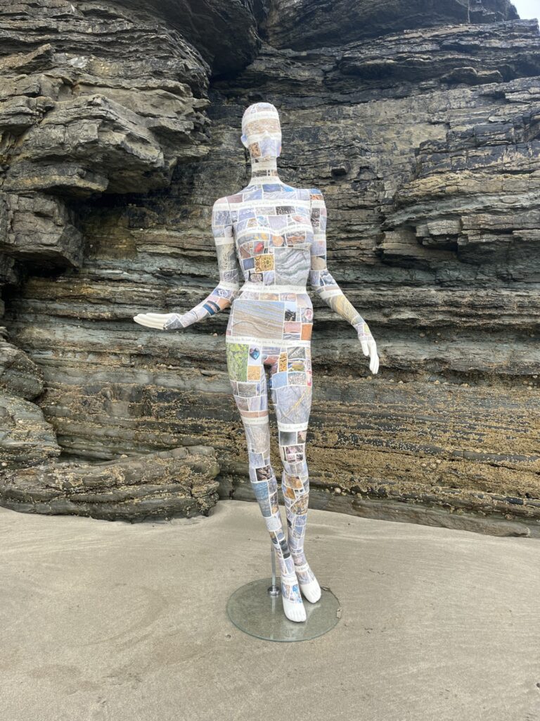 A Mannequin made by Lisa Poulsen, the design is hundreds of pictures of different rocks submitted by the public printer onto vinyl 