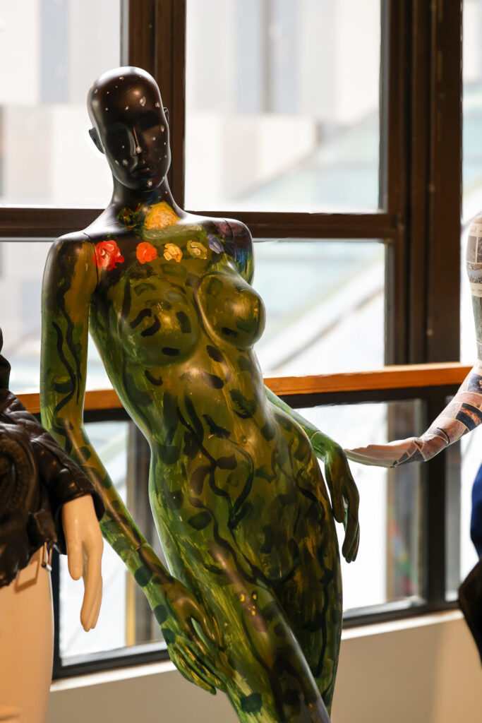 An Image showing a Mannequin designed by Room 13 Studio meaning to show inner peace, outer peace, connection, creativity, exercise and being outside. 